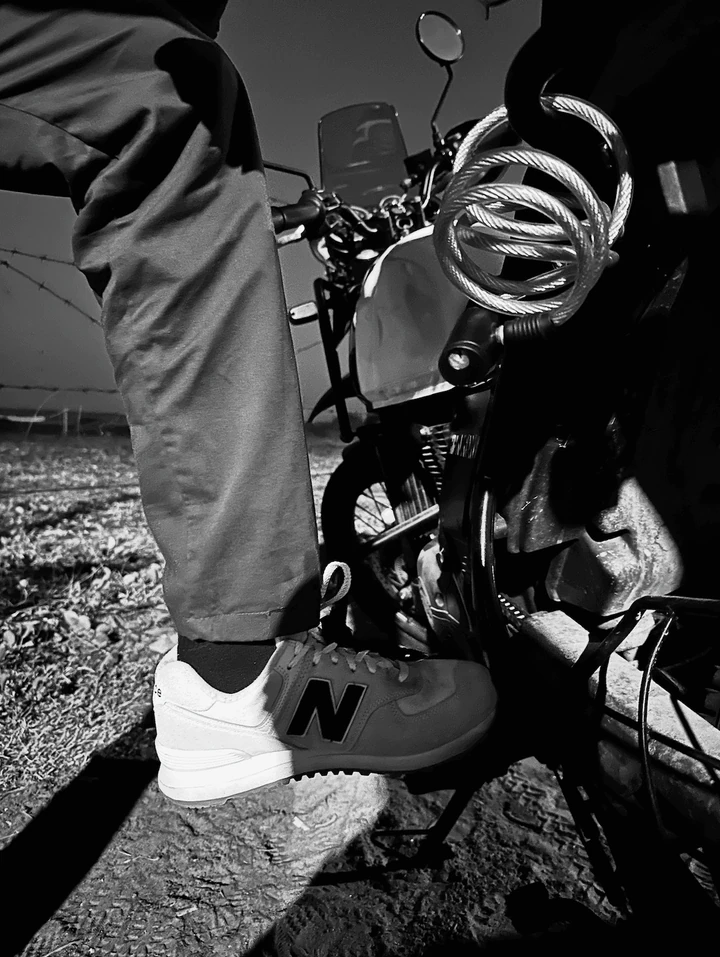 A black-and-white detail of shoes and diving equipment.
