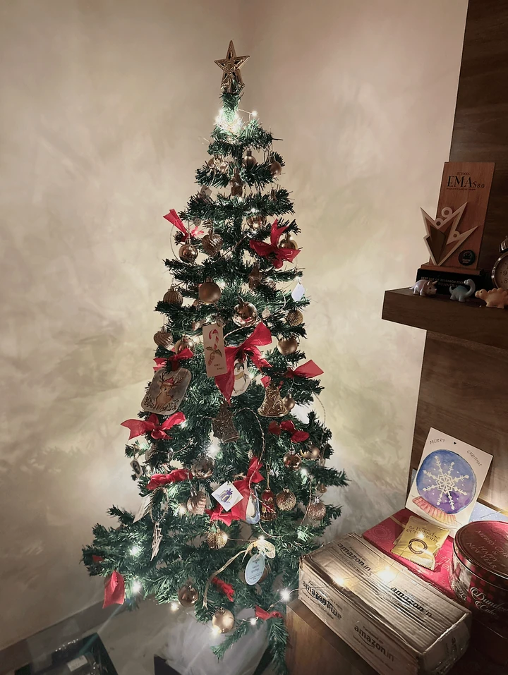 A decorated Christmas tree in a cosy room.